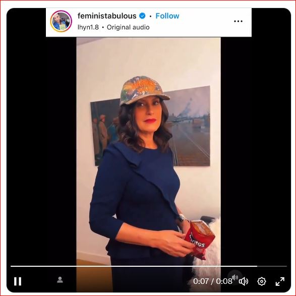 Whitmer mocks Catholicism in a Harris/Walz cap, dispensing a Dorito as a 'Eucharist' to a leftist internet 'influencer'